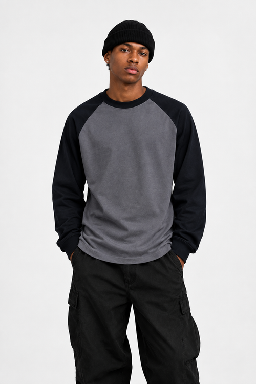 Front-facing model wearing the charcoal-and-black raglan tee 300gsm Daniel Alaves long sleeve oversized t-shirt