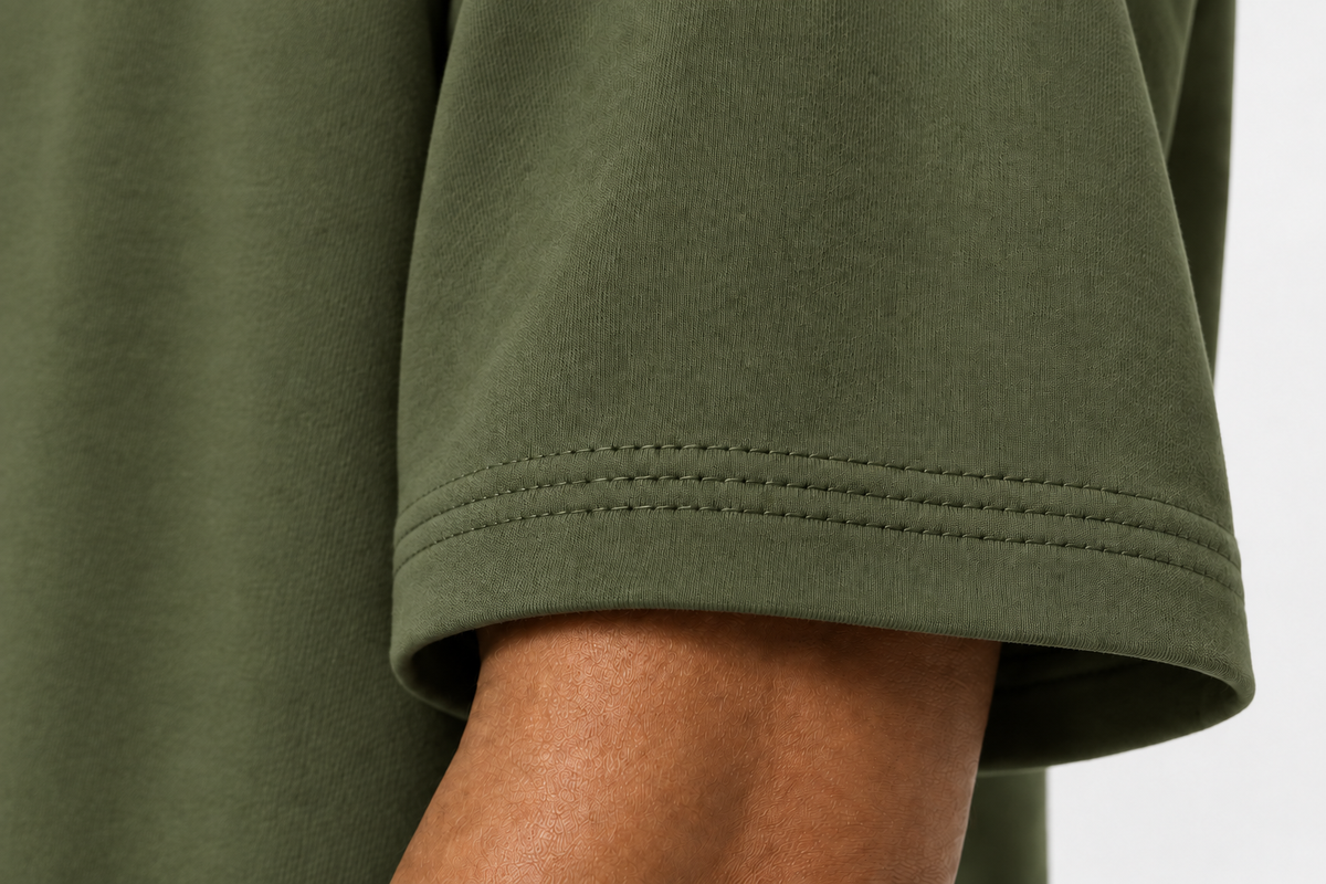 Sleeve Cuff of olive-green oversized t-shirt 