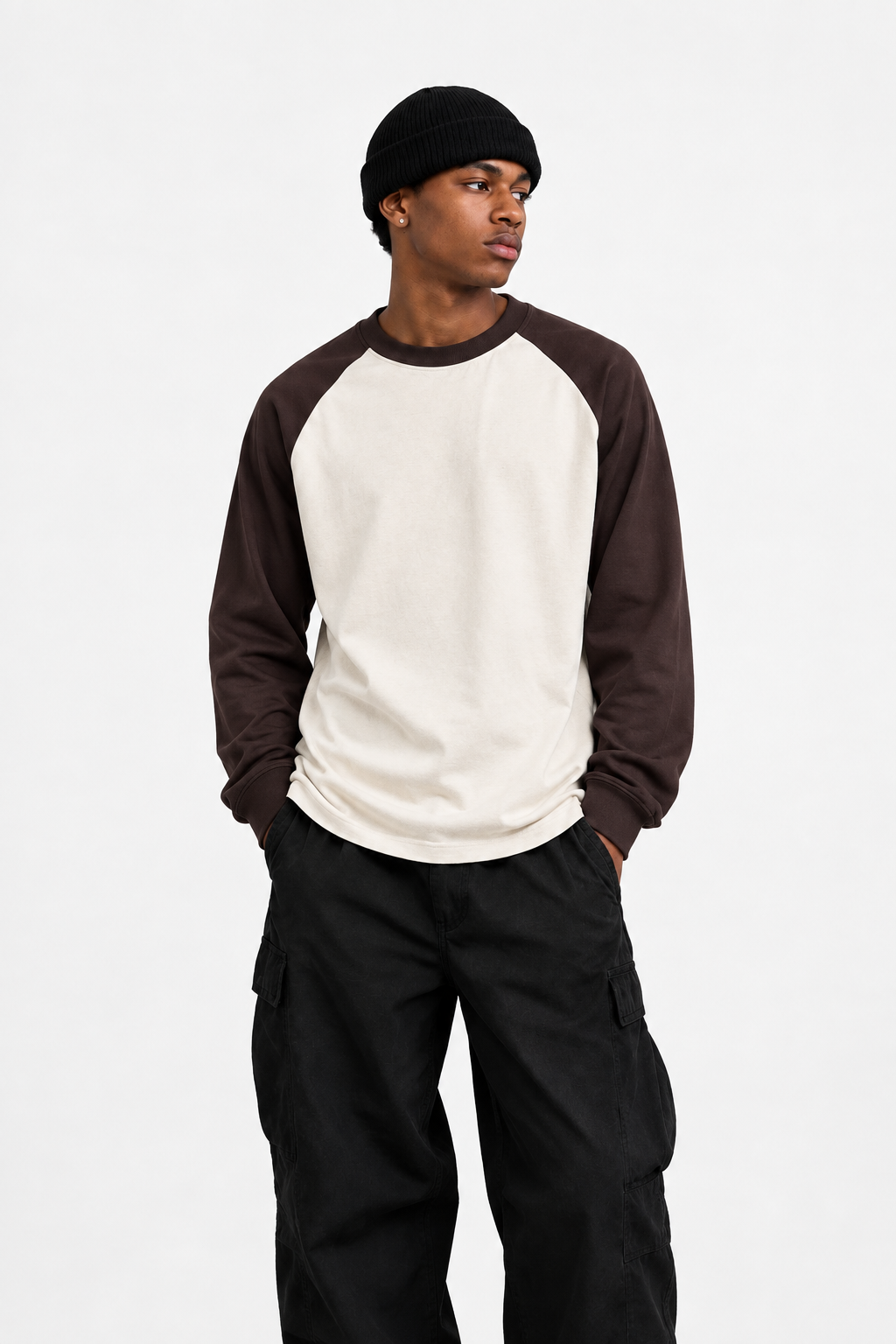 Portrait of model wearing the cream-and-brown raglan tee Daniel Alaves Raglan Long Sleeve Tee — 300GSM | Cream / Brown